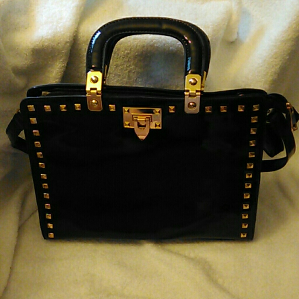Black patent leather purse with accents
